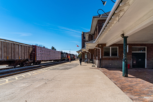 Stratford, Canada - April 2, 2023: A CN train is entering the railway station. The view of train station, Stratford, Canada.
