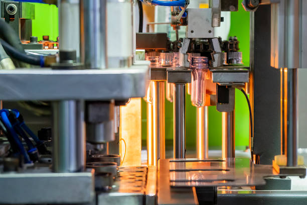 istock The drinking water bottle manufacturing process by blow mold machine. 1490818224