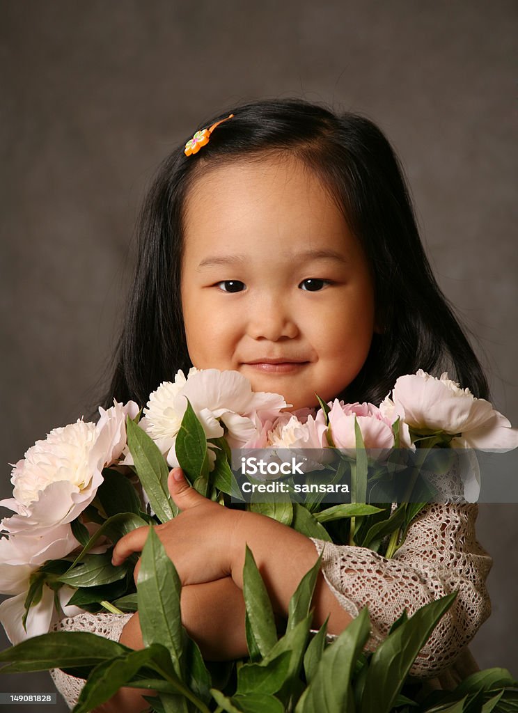 Bouquet of peonies The small Korean girl with a bouquet of peonies Beautiful People Stock Photo