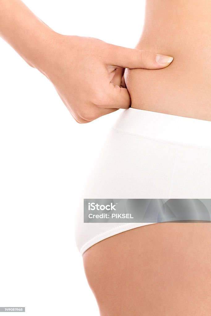 Woman pinching fat on waist http://www.edkafelek.com/beauty.jpg Abdomen Stock Photo