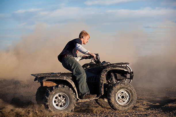 istock teen riding ATV quad 149082121