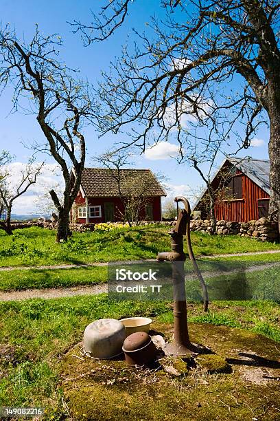 Old Hand Operated Water Pump Stock Photo - Download Image Now - Agricultural Building, Agriculture, Bare Tree
