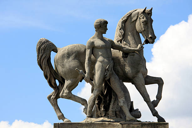 Statue in Pont d'lena (Man holding a horse) stock photo