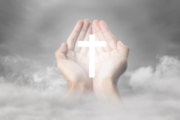 istock A human hand showing a Christian cross 1490822678
