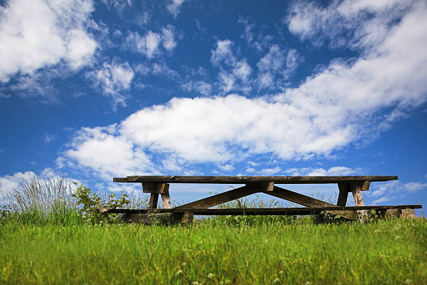 Park bench on sky backround stock photo