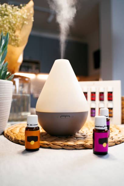 istock Aroma therapy and air purifier. Essential oils next to diffuser working and vapor coming out of it 1490825020