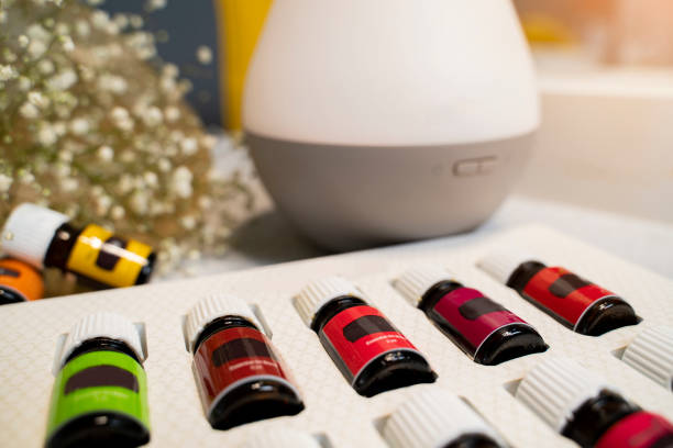 istock Closeup of essential oils bottles and air diffuser in background 1490825023