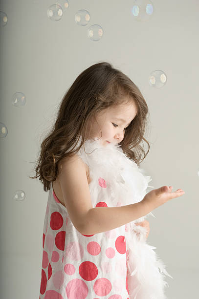 istock Little girl playing with bubbles 149082553