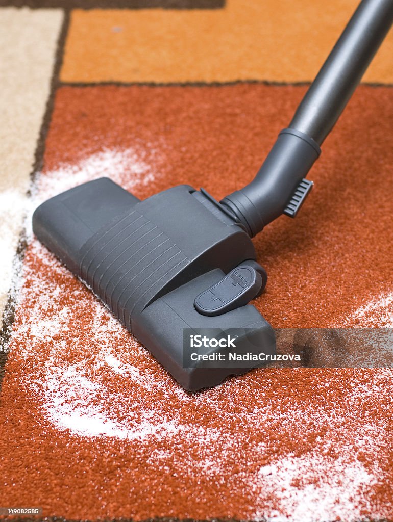 Vacuum cleaner Cleaning by a vacuum cleaner, collects dust Beige Stock Photo