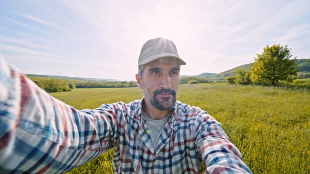 istock Farmer vlogging in wheat crops at sunset in spring. 1490831324