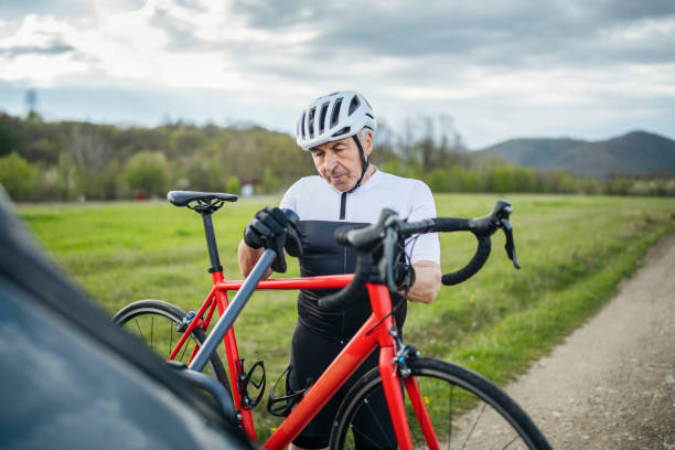 istock Active senior is unloading his gravel bike from the car. 1490832830