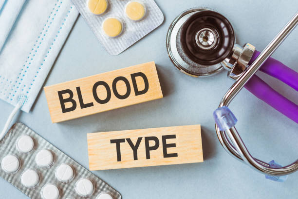 BLOOD TYPE written on wooden cubes on medical background. BLOOD TYPE written on wooden cubes on medical background. blood typing stock pictures, royalty-free photos & images