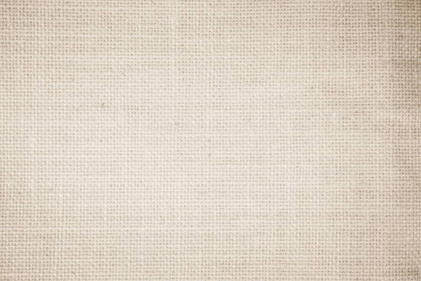 istock Jute hessian sackcloth burlap canvas woven texture background pattern in light beige cream brown color blank. Natural weaving fiber linen and cotton cloth texture as clean empty for decoration. 1490835411