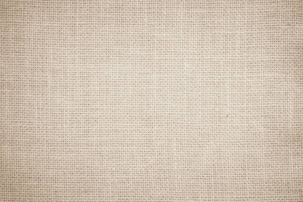 istock Jute hessian sackcloth burlap canvas woven texture background pattern in light beige cream brown color blank. Natural weaving fiber linen and cotton cloth texture as clean empty for decoration. 1490835412