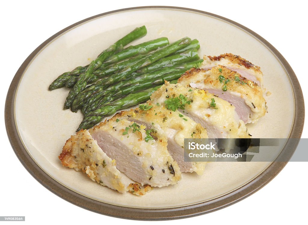 Chicken Baked with Lemon, Parmesan and Herbs Chicken breast fillet encrusted with breadcrumbs, lemon, Parmesan cheese and herbs. Asparagus Stock Photo