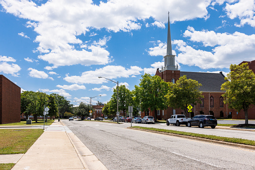 Road view on Church Cathedral in Downtown district of small American town on North King Street, Hampton, Virginia, USA