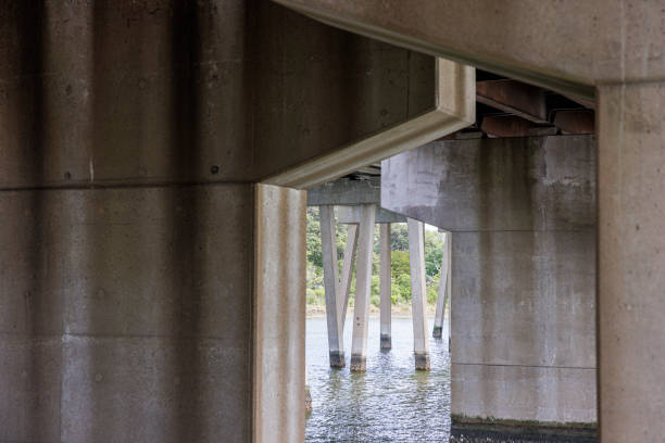 istock Flooding in spring. Peeking through the bridge gap on the river. Architecture feature in Hampton, VA 1490837319