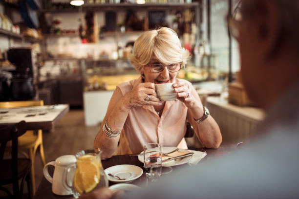 istock Senior couple enjoying a meal at a local small restaurant 1490837536