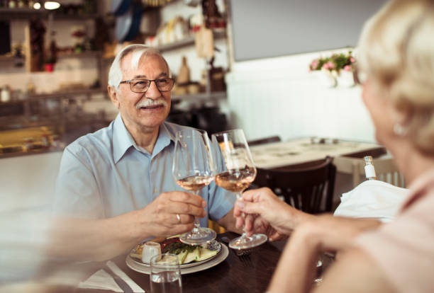 istock Senior couple enjoying a meal at a local small restaurant 1490837585
