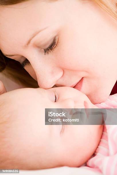 Mother And The Small Child Stock Photo - Download Image Now - 0-11 Months, Adult, Affectionate