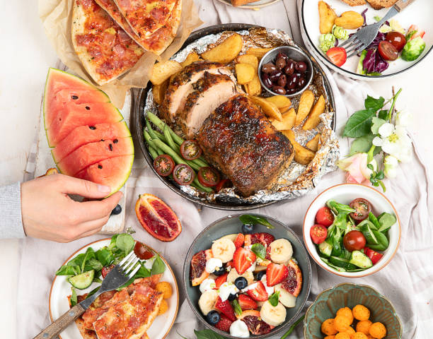 istock Family dinner or lunch. Many dishes on the table. Top view, copy space 1490845369