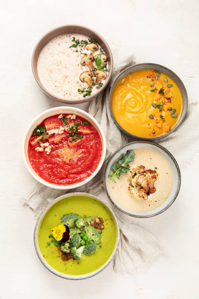 istock Composition with various soups, ingredients and space for text on white background. Healthy food. 1490845649