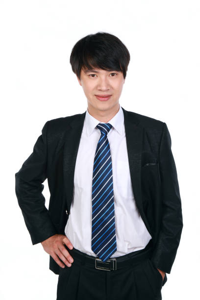 Frontal view of young Asian business man on white background
