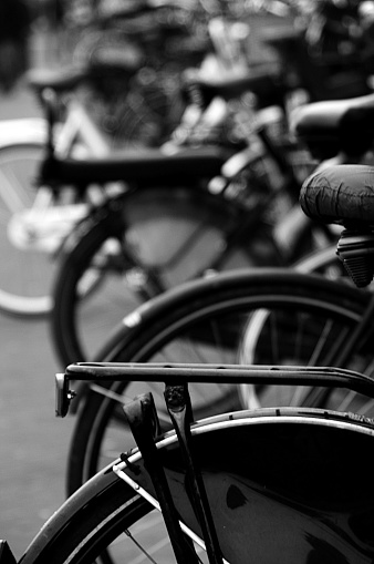 Detail shot of several classic\nBicycles standing in black and white