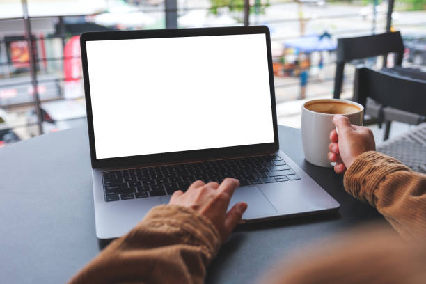 istock Mockup image of a woman using and working on laptop computer with blank white desktop screen 1490847804
