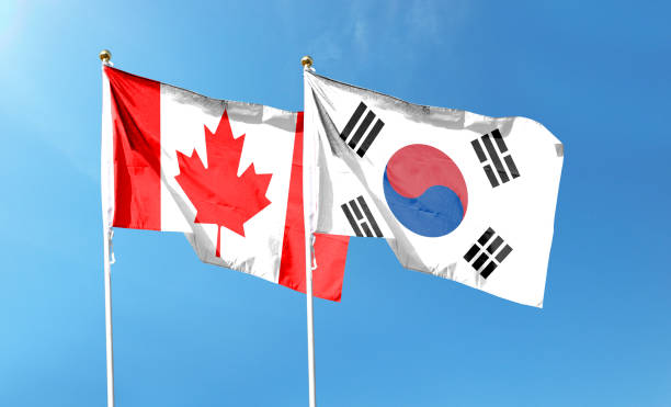 istock South Korea flag and Canada flag. waving in the blue sky 1490847828