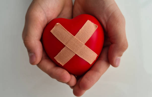 istock Wounded heart with plaster in children hands 1490850531