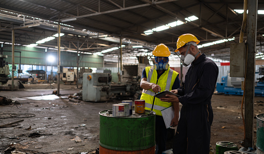 Scientists and government officials Inspect and collect chemical leak samples in industrial sites. to be thoroughly investigated in the laboratory