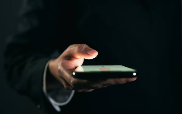 istock Businessman hand using smartphone and press scan fingerprints your username and password to access the system, login screen, private data and prevent identity. 1490854410