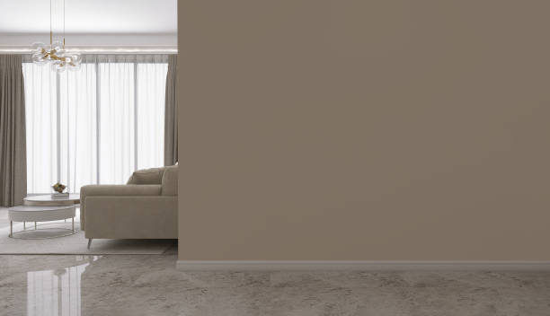 istock Blank beige brown corner wall, living room with corner sofa, round coffee table on rug, modern chandelier light in sunlight from floor to ceiling curtain on marble floor 1490858025