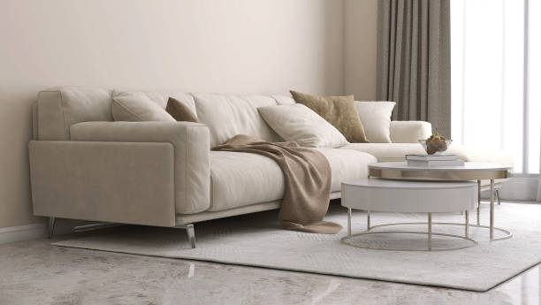 istock Two layer round white marble top coffee table, beige corner sofa on gray shag rug on marble floor in sunlight from sheer curtain window on beige wall luxury living room 1490858030