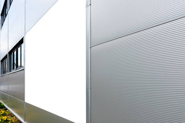 istock Mockup template. Big horizontal white blank advertising,billboard on modern business building wall outdoors. 1490858730