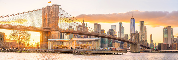 New York City skyline cityscape of Manhattan with brooklyn bridge in USA at sunset