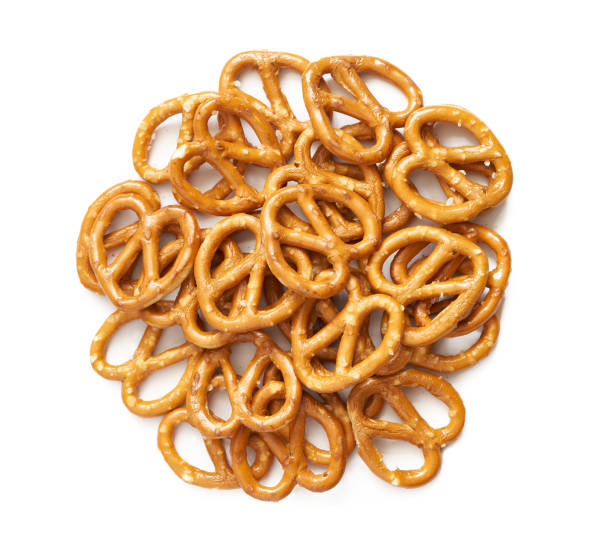 istock top view overhead mini salted pretzel isolated on white background. salted cracker pretzel isolated on white background. salty, snack, appetizer, mini pretzel isolated flat lay 1490867556