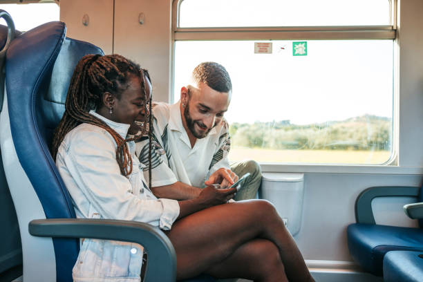 istock Happy couple traveling by train 1490870650