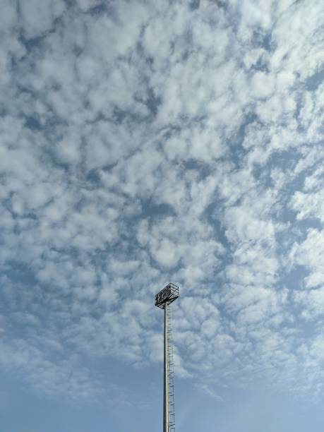 istock Light Tower in Football Stadium 1490871075