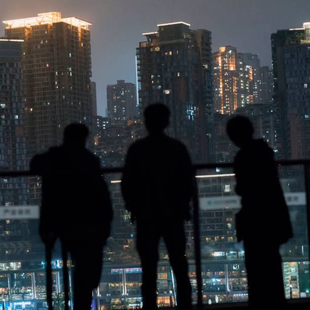istock Three people in a gorgeous city night scene 1490873028