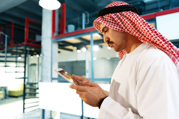 istock Arab muslim businessman using digital tablet in modern office 1490875112