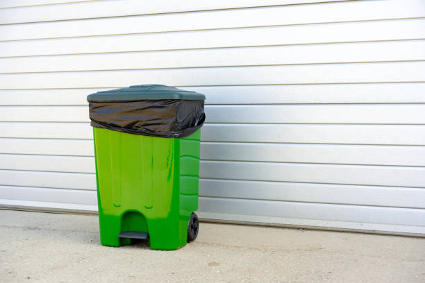 istock Green plastic garbage container standing in the street 1490875135
