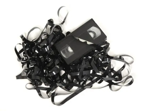 Photo of Broken video tape isolated on white background