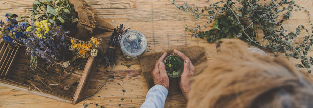 istock Grandmother makes tea with medicinal herbs. Selective focus. 1490881837