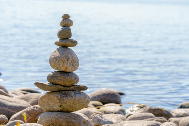 istock Pyramid of stones. Unstable balance of stone objects. 1490885042