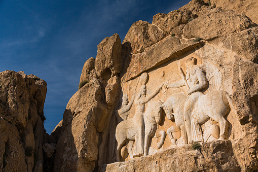 Naghsh-e Rostam is an ancient necropolis located in the Fars Province of Iran, about 12 km northwest of the city of Persepolis. It contains the tombs of several Achaemenid kings, as well as rock reliefs depicting scenes from the lives and reigns of these kings.