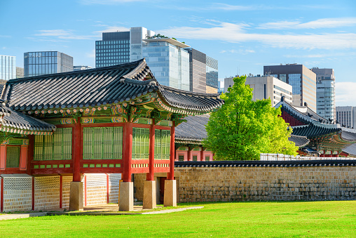 Scenic view of colorful building and courtyard of Gyeongbokgung Palace in Seoul, South Korea. Traditional Korean palatial architecture. Gyeongbokgung Palace is a popular tourist attraction of Asia.