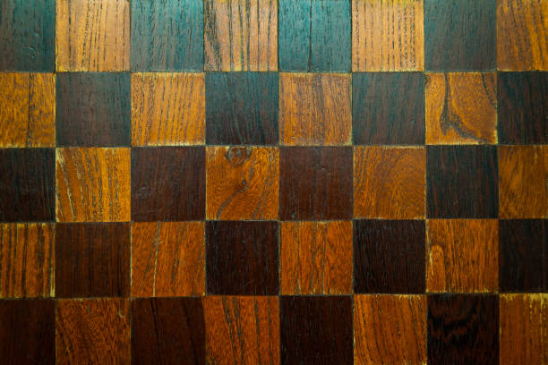 istock An old wooden chessboard without pieces. 1490892235