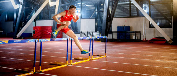 istock Woman running and jumping through hurdle 1490896017